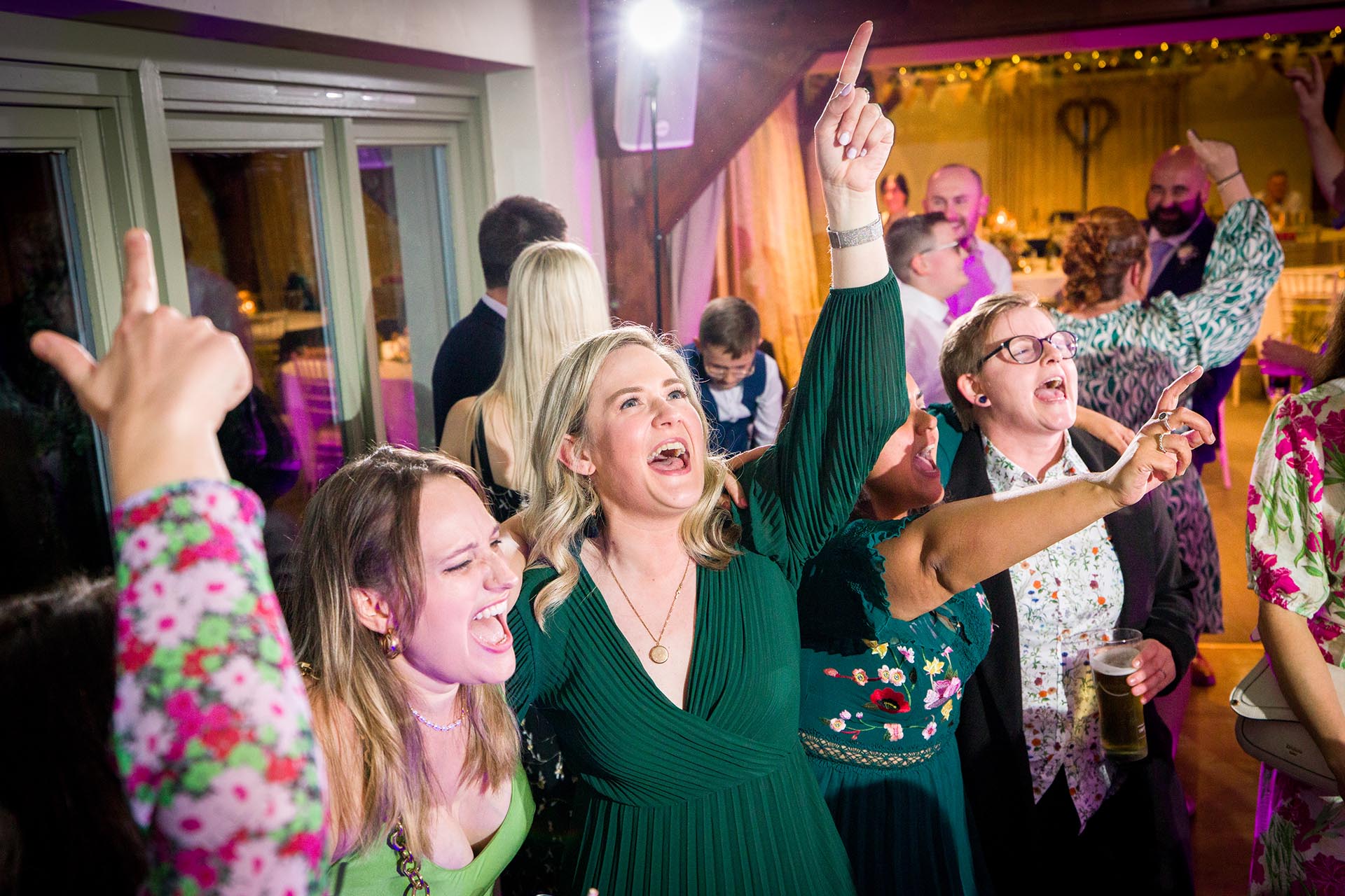 Essex wedding photographer on the dancefloor at The Compasses at Pattiswick