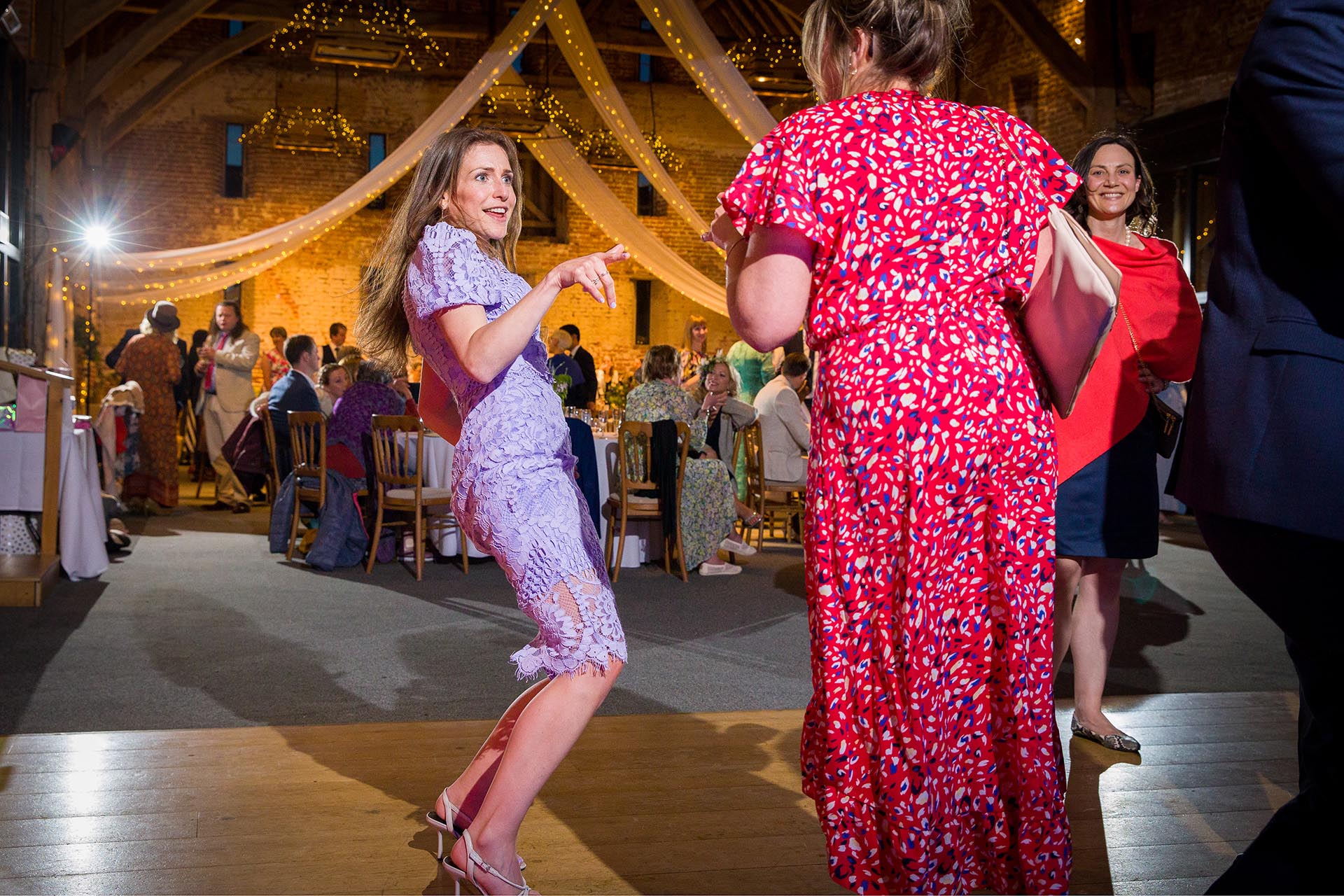 On the dance floor in the Anne of Cleves Barn by Essex wedding photographer at Great Lodge, Great Bardfield