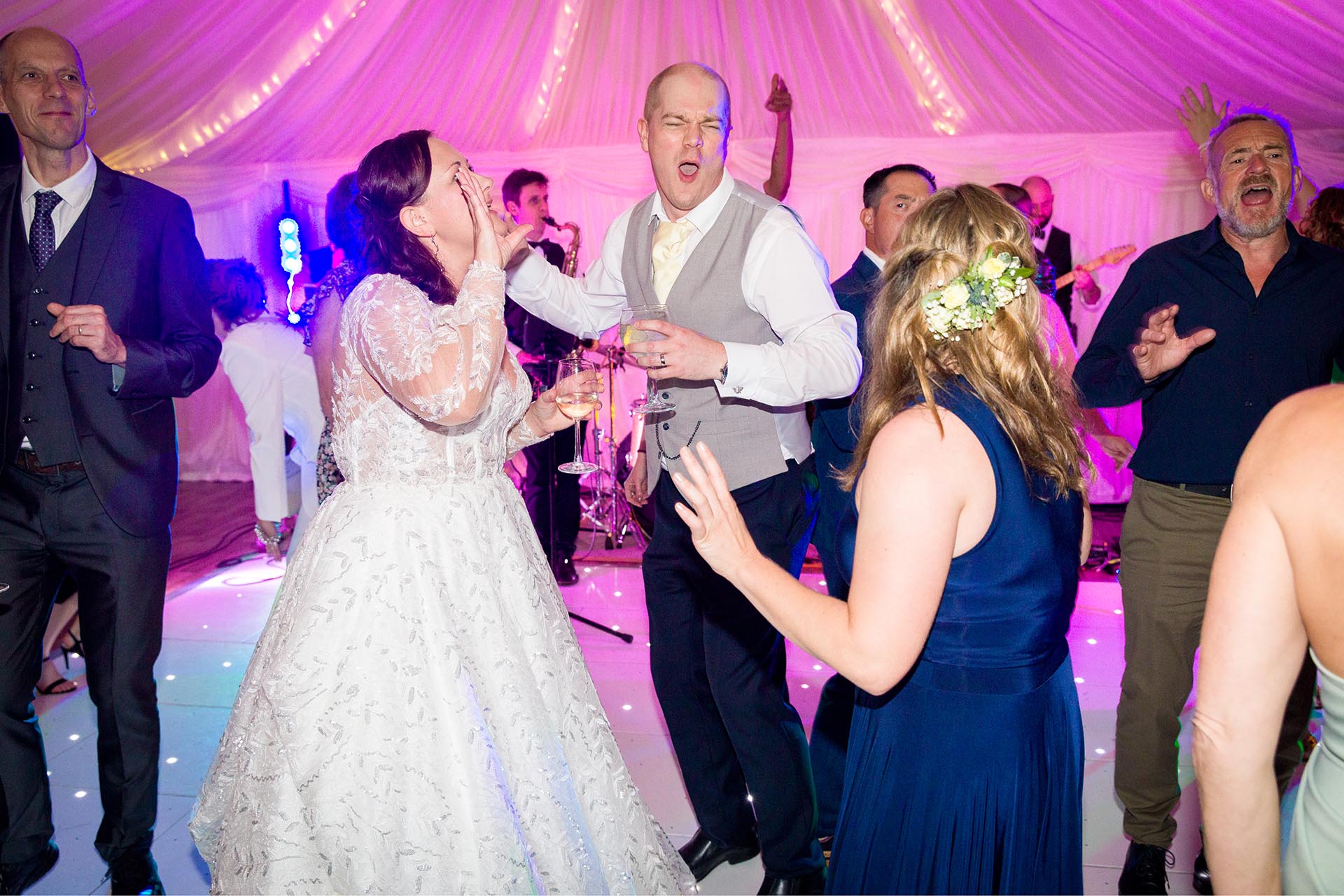 Bride and groom dancing by Essex wedding photographer at Mulberry House High Ongar