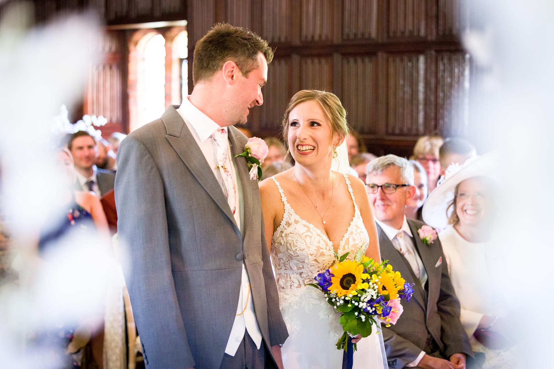 Bride and groom during their wedding ceremony at Leez Priory, Great Leighs, Chelmsford by Essex wedding photographer