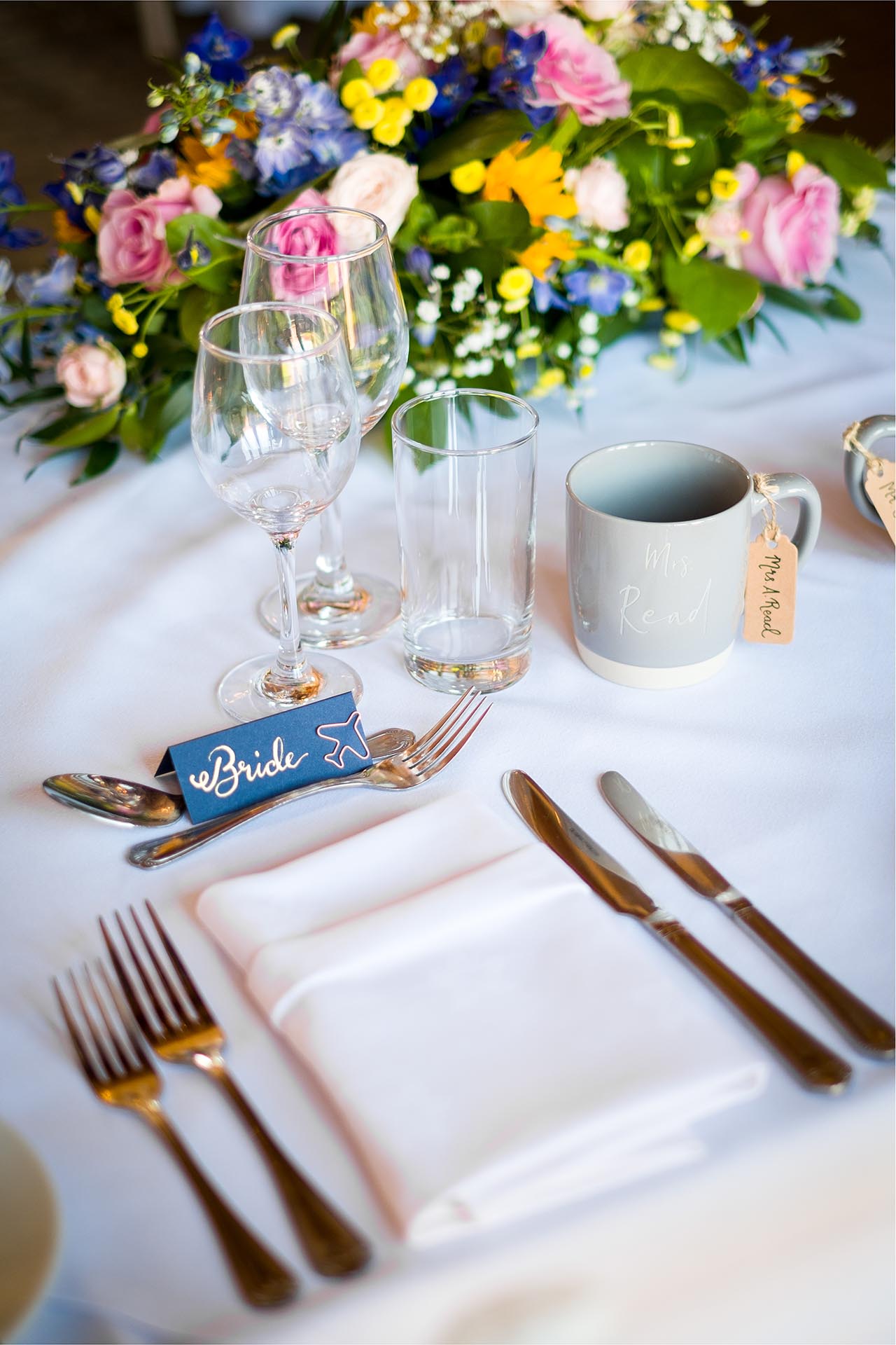 Bespoke table decorations for wedding breakfast at Leez Priory, Great Leighs, Chelmsford, by Essex wedding photographer