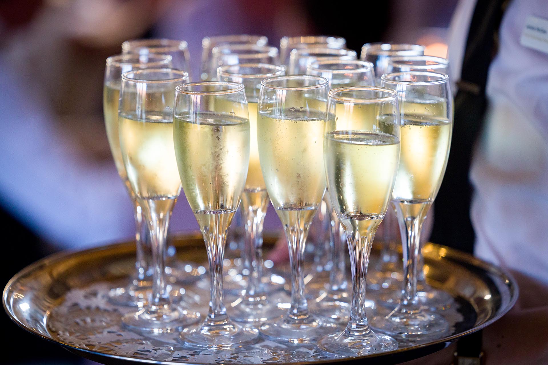 Full champagne flutes during wedding breakfast at Leez Priory, Great Leighs, Chelmsford, by Essex wedding photographer