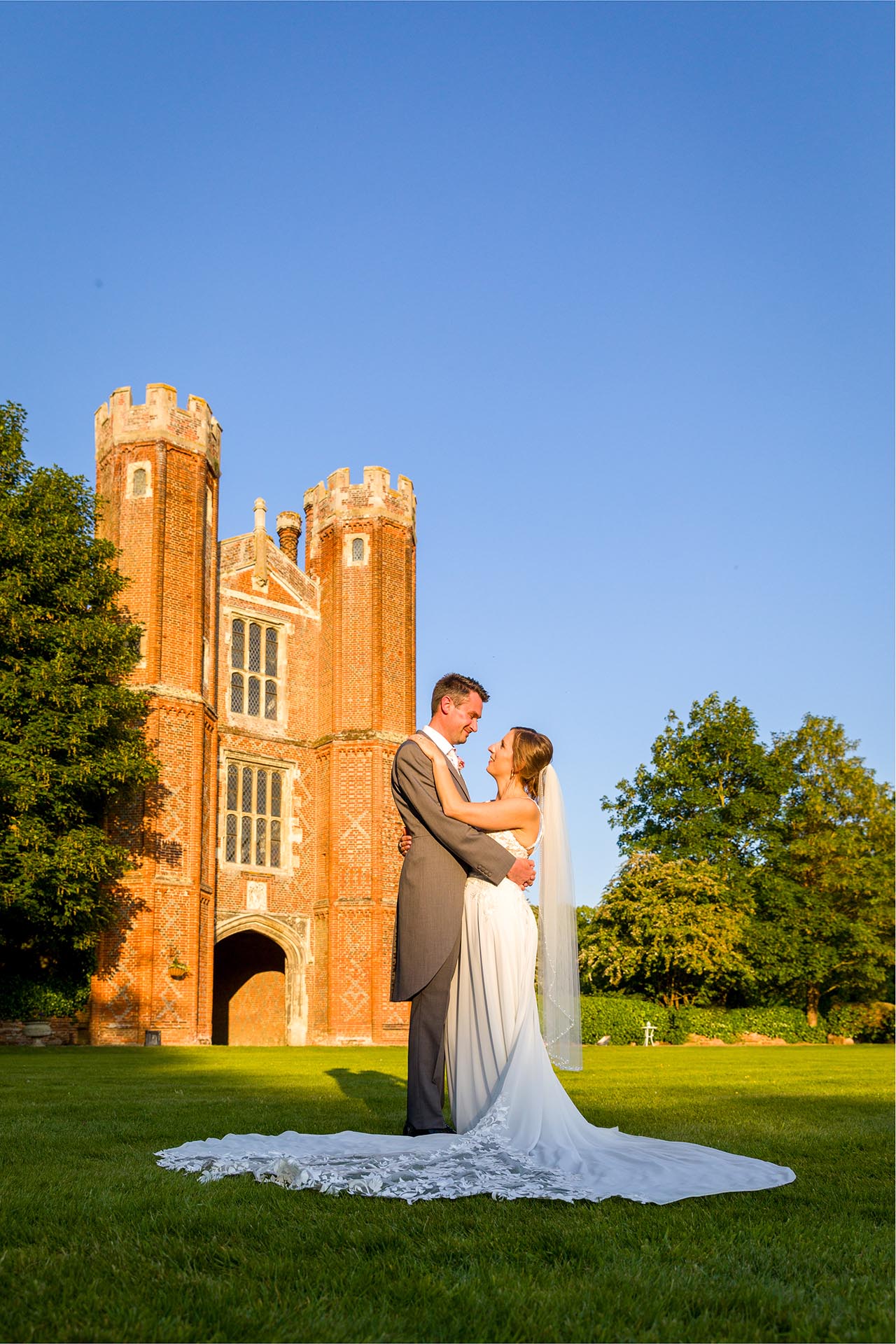 Bride and groom golden light photograph at Leez Priory, Great Leighs, Chelmsford, by Essex wedding photographer