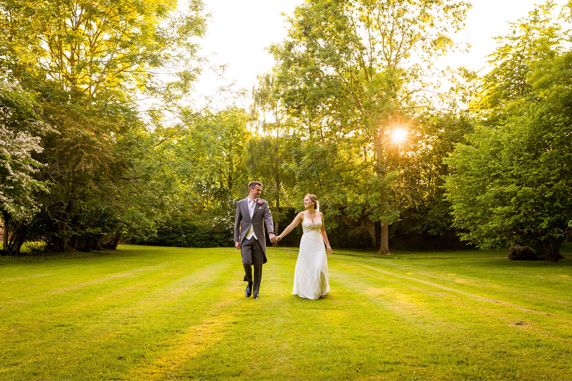 Bride and groom golden light photograph at Leez Priory, Great Leighs, Chelmsford, Essex