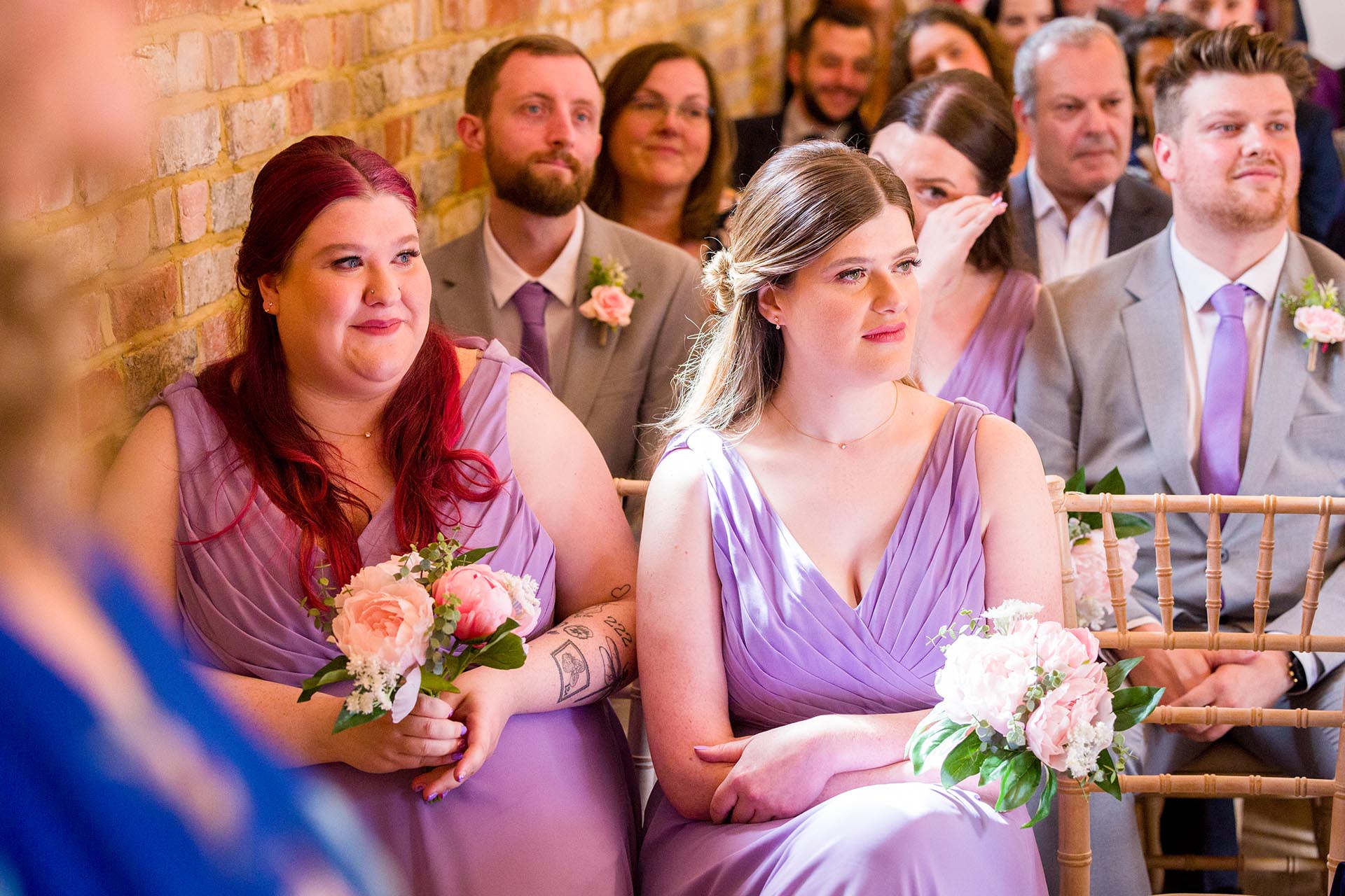 Photograph of tearful bridesmaids during the wedding ceremony at Apton Hall, Rochford, Essex