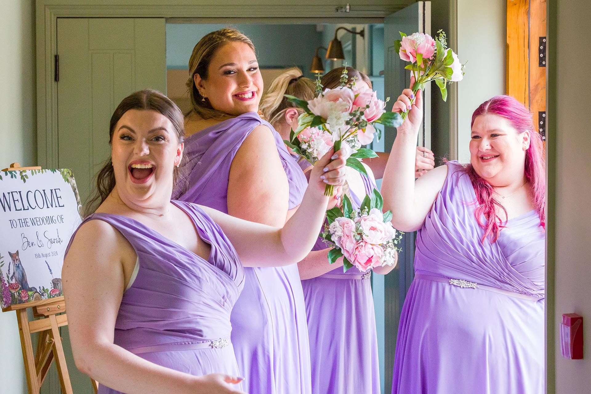 Photograph of bridesmaids cheering at Apton Hall, Rochford, Essex