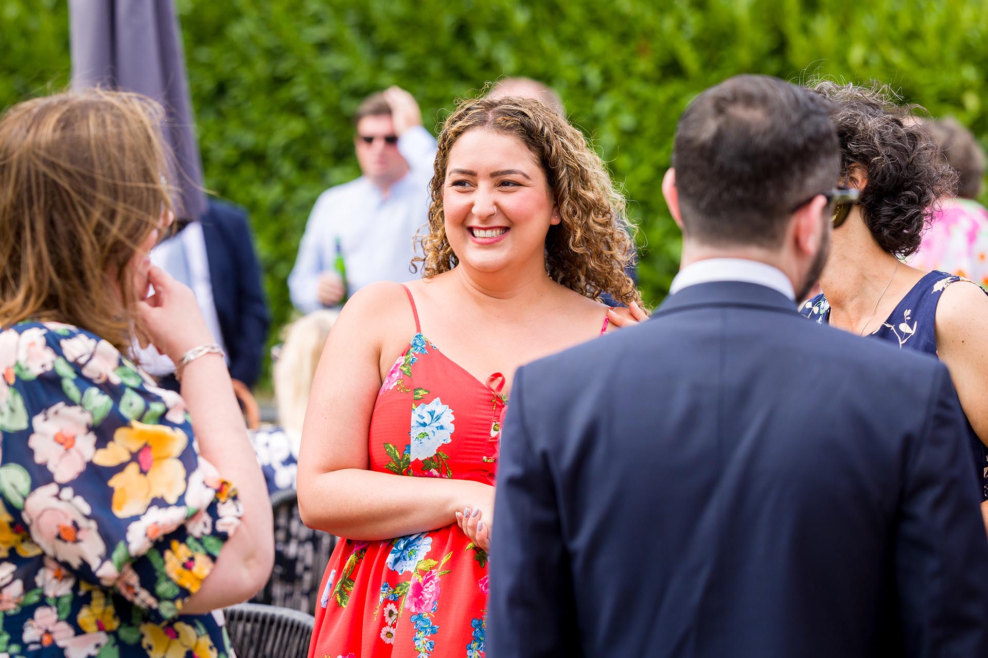 Candid photograph of a wedding guest at Apton Hall, Rochford, Essex