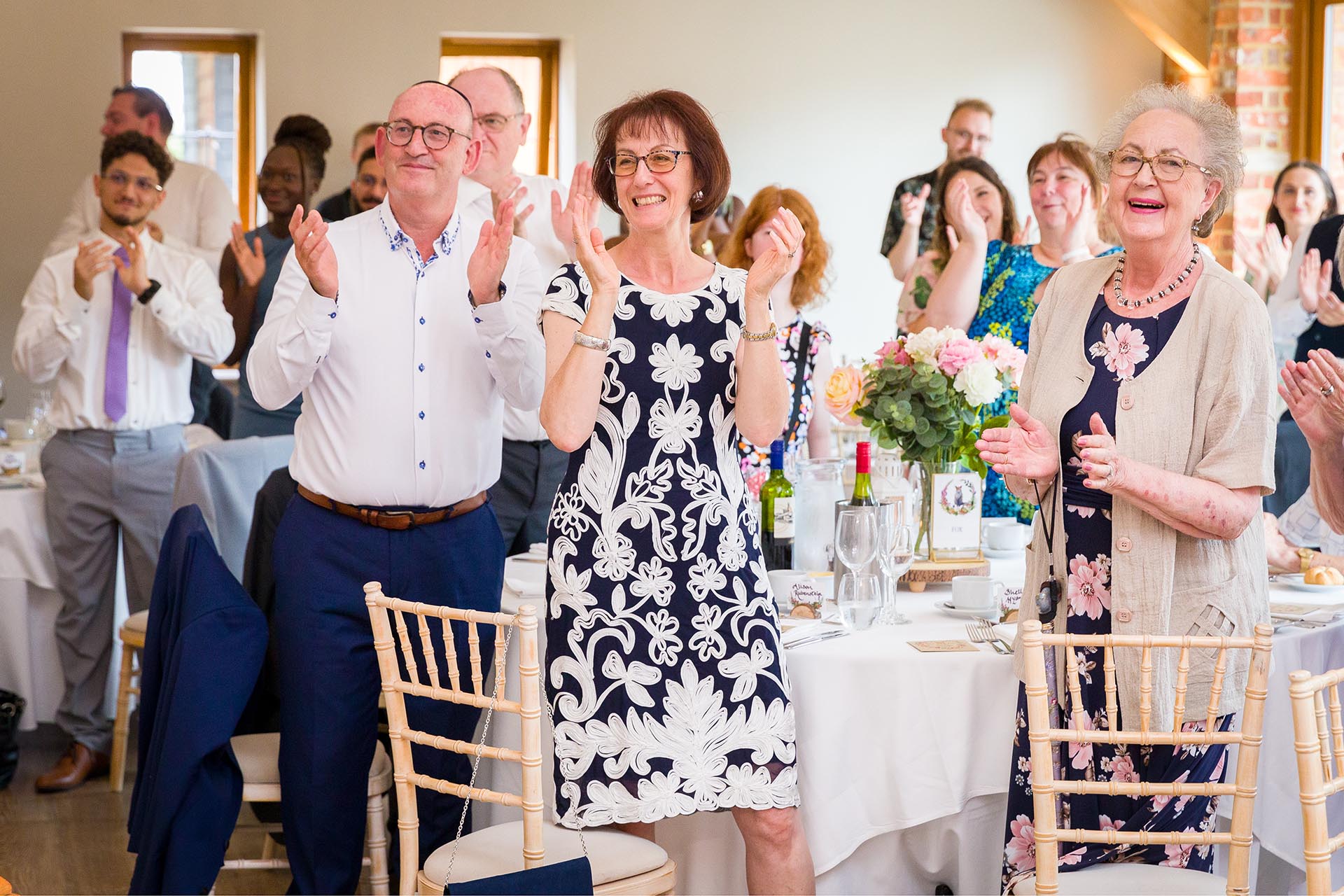 Photograph of wedding guests cheering at Apton Hall, Rochford, Essex