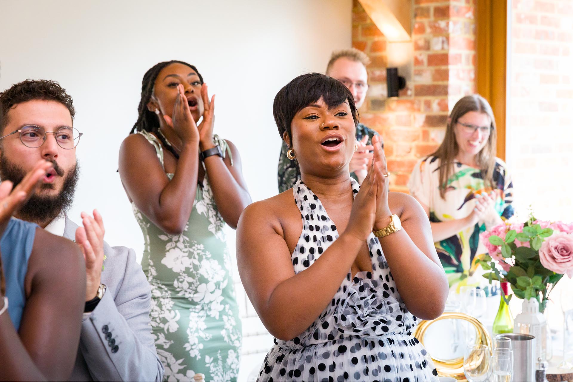 Photograph of wedding guests cheering at Apton Hall, Rochford, Essex