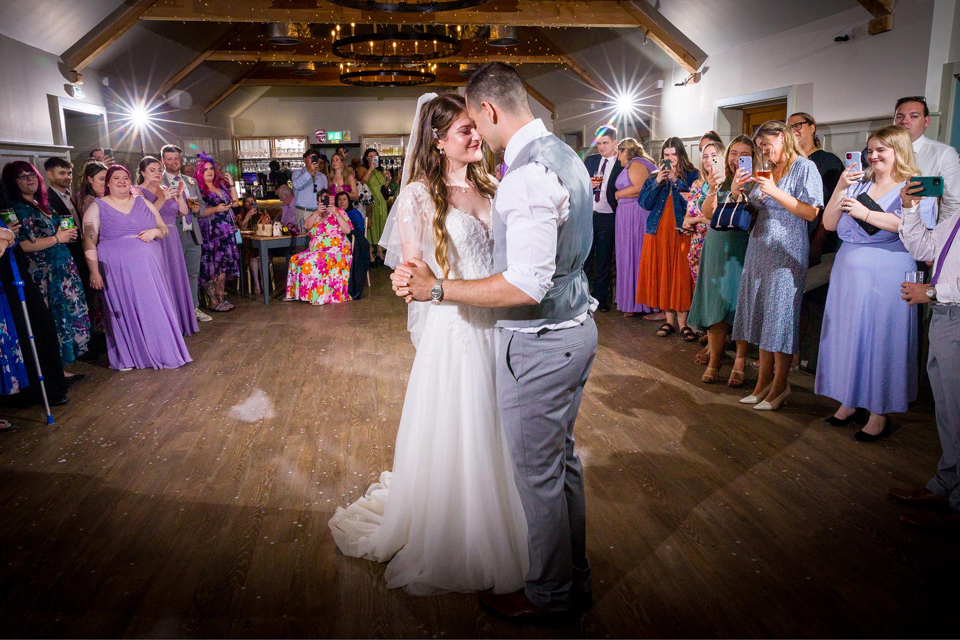 Colourful photograph of bride and groom dancing at Apton Hall, Rochford, Essex