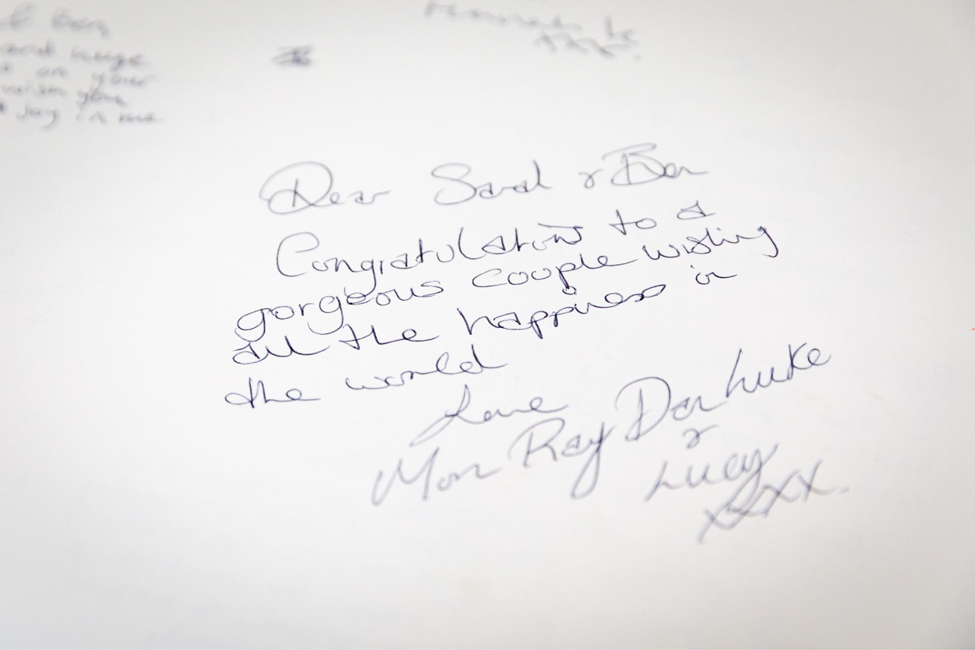 Photograph of congratulations message in a wedding guest book