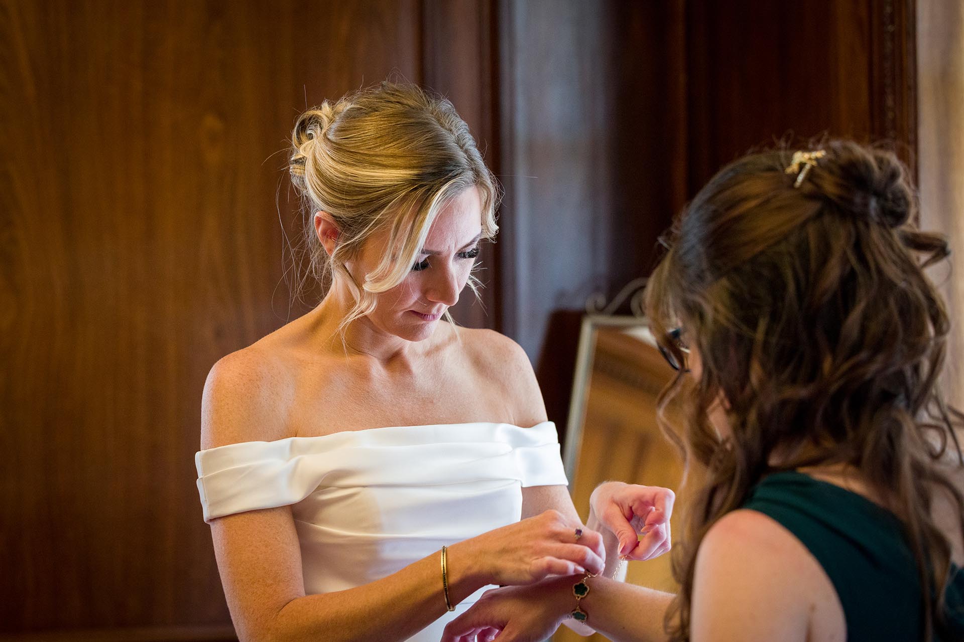 Photograph of bride preparing for wedding