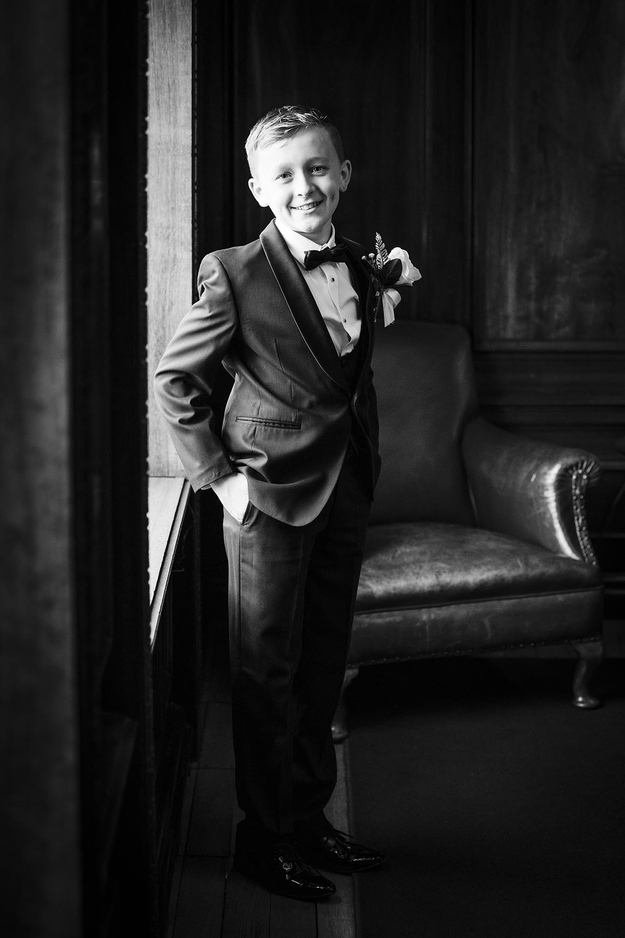 Black and white photograph of young groomsman at Braintree Town Hall, Braintree, Essex