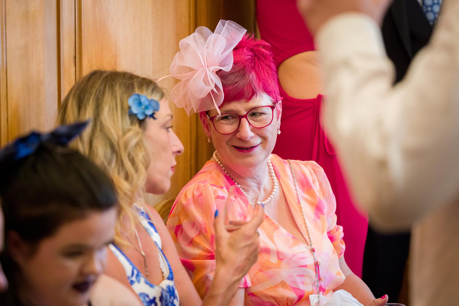 Photograph of a smiling wedding guest