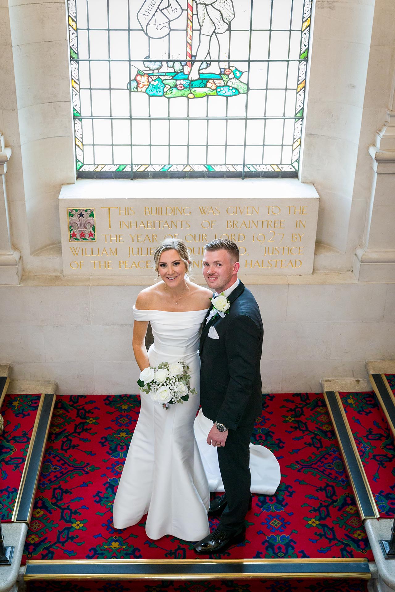 Photograph of bride and groom on the staircase at Braintree Town Hall, Braintree, Essex