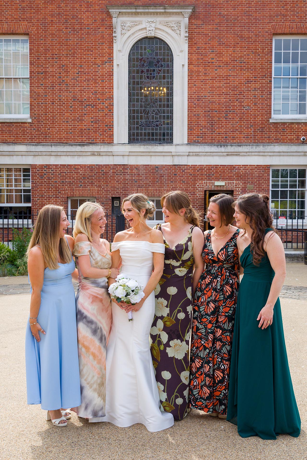 Photograph of the bride and friends laughing at Braintree Town Hall, Braintree, Essex