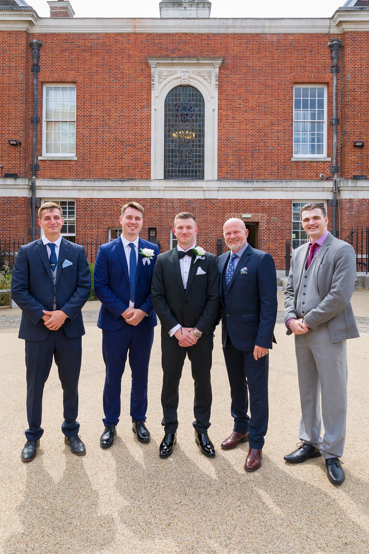Group photograph of the groom and friends at Braintree Town Hall, Braintree, Essex