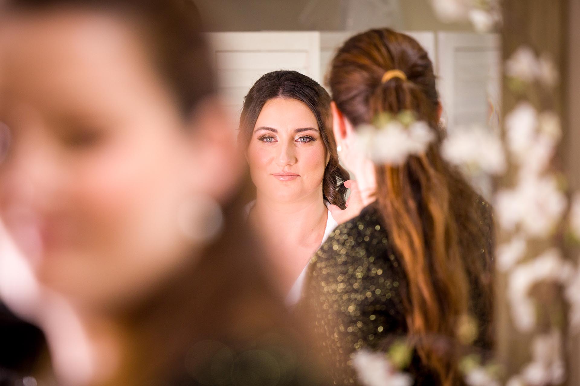 Photograph of bride preparing for her wedding