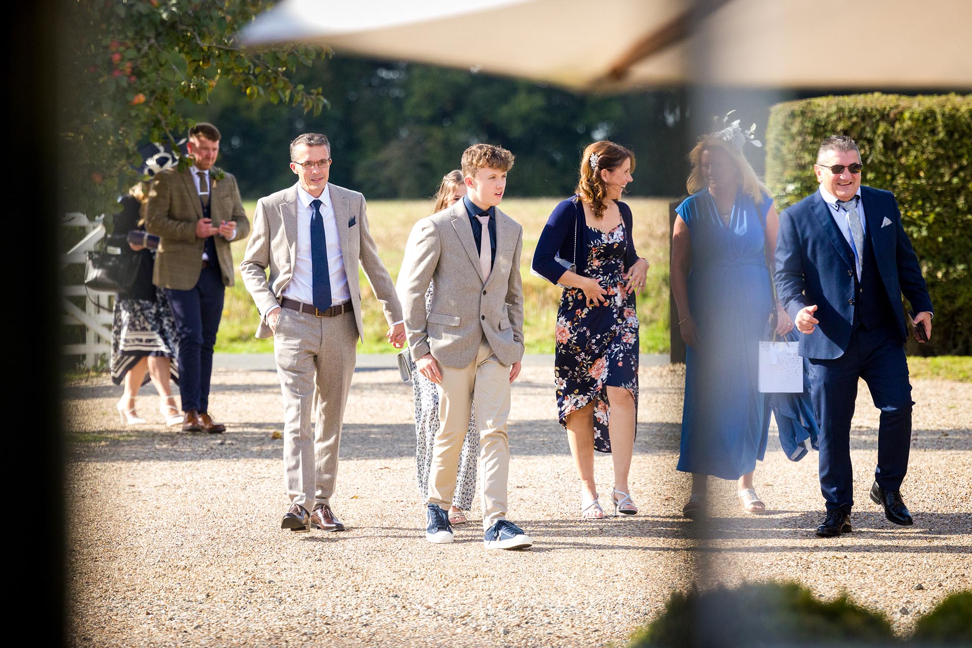 Photograph of wedding guests arriving at The Compasses at Pattiswick, Essex
