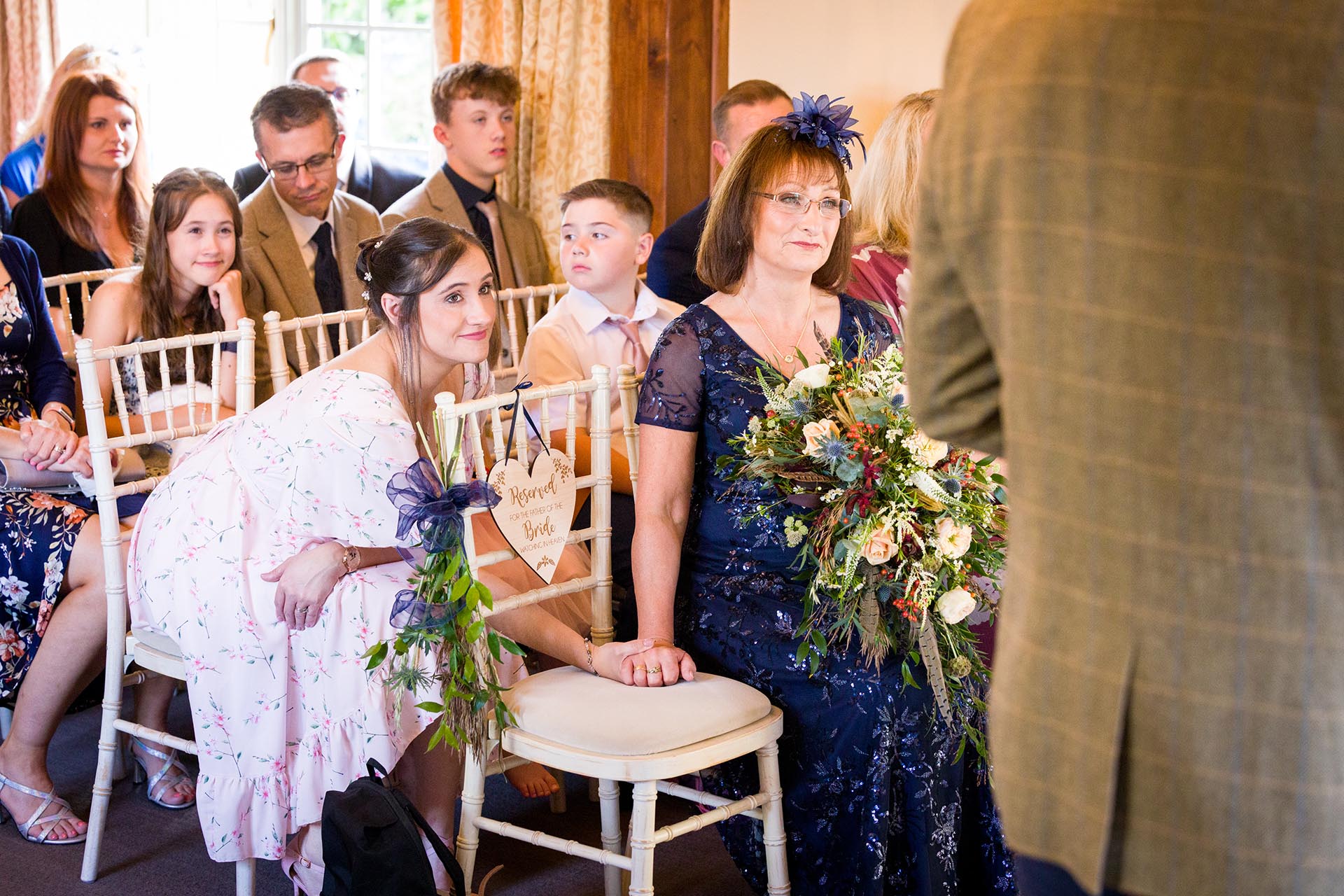 Photograph of guests in the ceremony room at The Compasses at Pattiswick, Essex