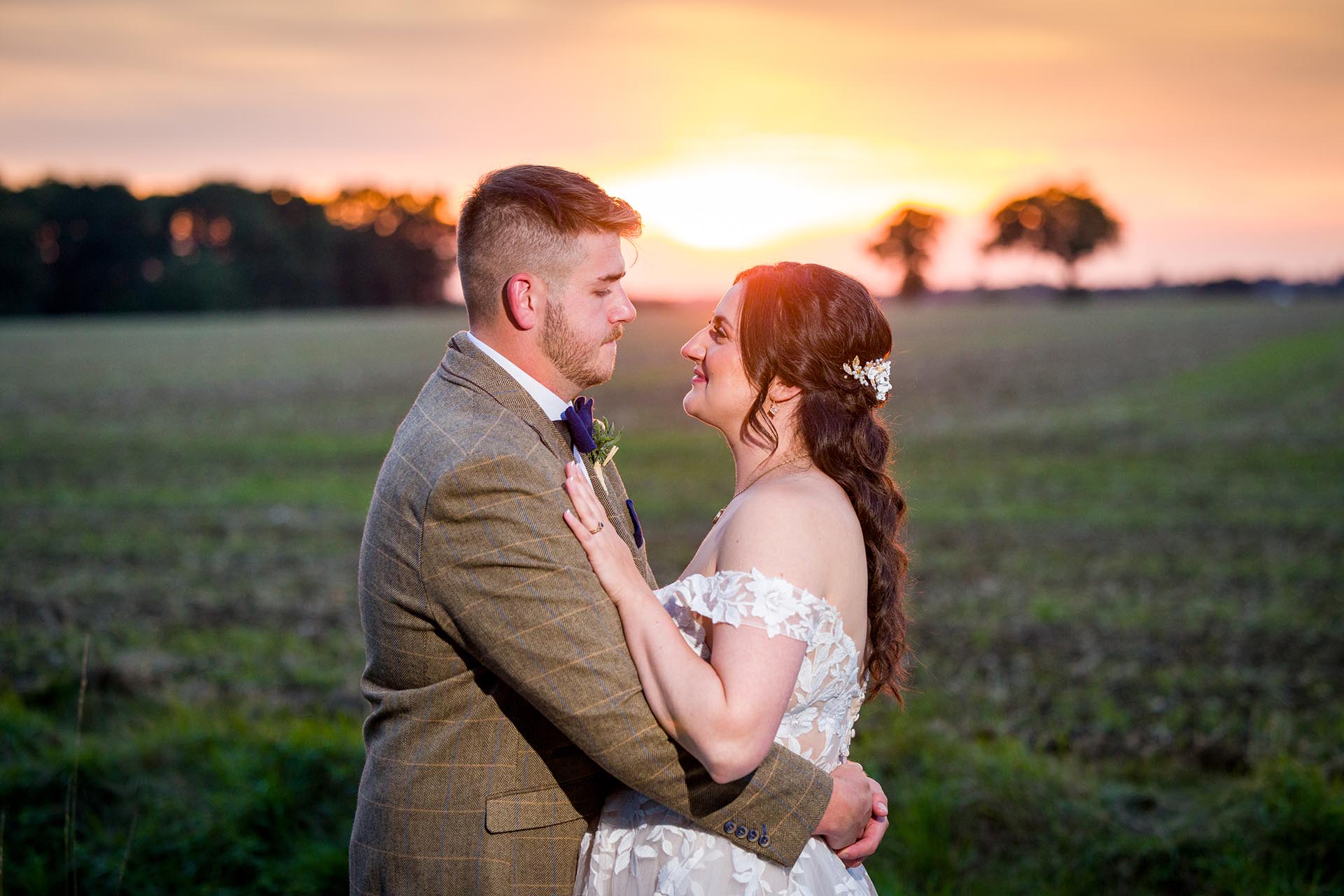 Photograph of bride and groom at sunset at The Compasses at Pattiswick