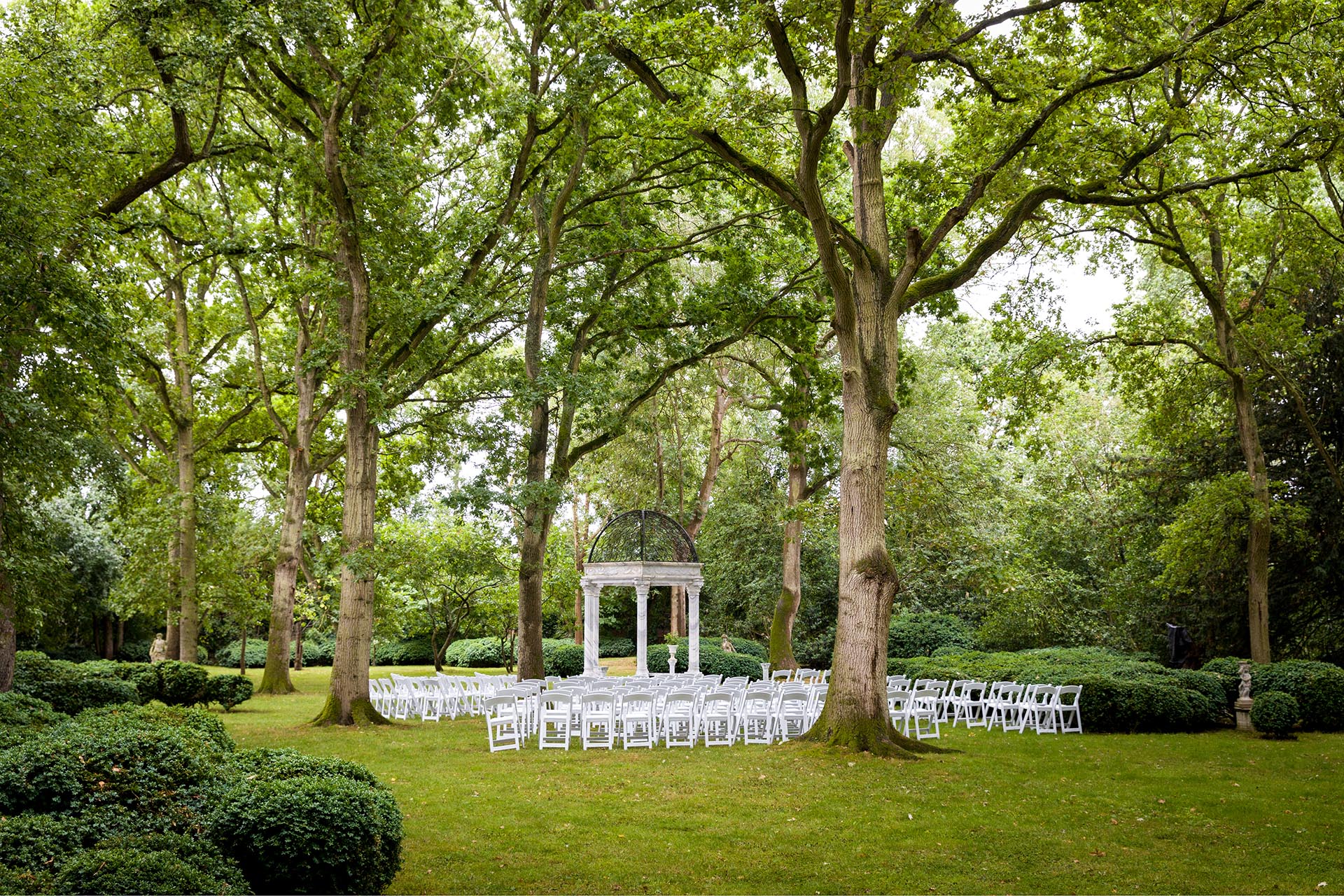 Photograph of the orchard set for a wedding ceremony at Creeksea Place, Burnham-on-Crouch, Essex