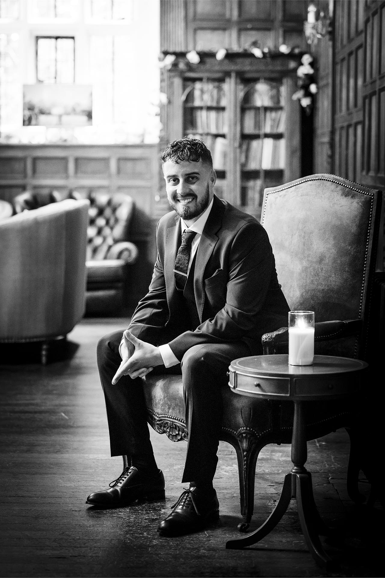 Black and white portrait photograph of groom before his wedding at Creeksea Place, Burnham-on-Crouch, Essex