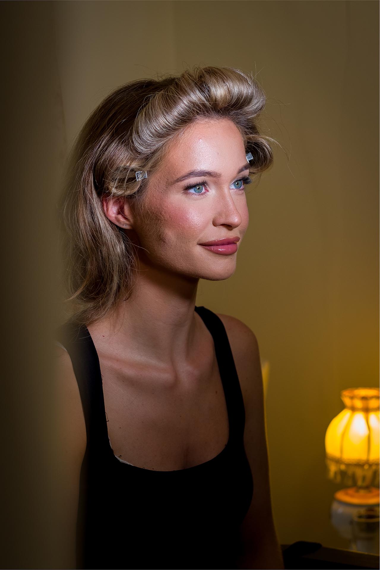 Photograph of bridesmaid during wedding preparations