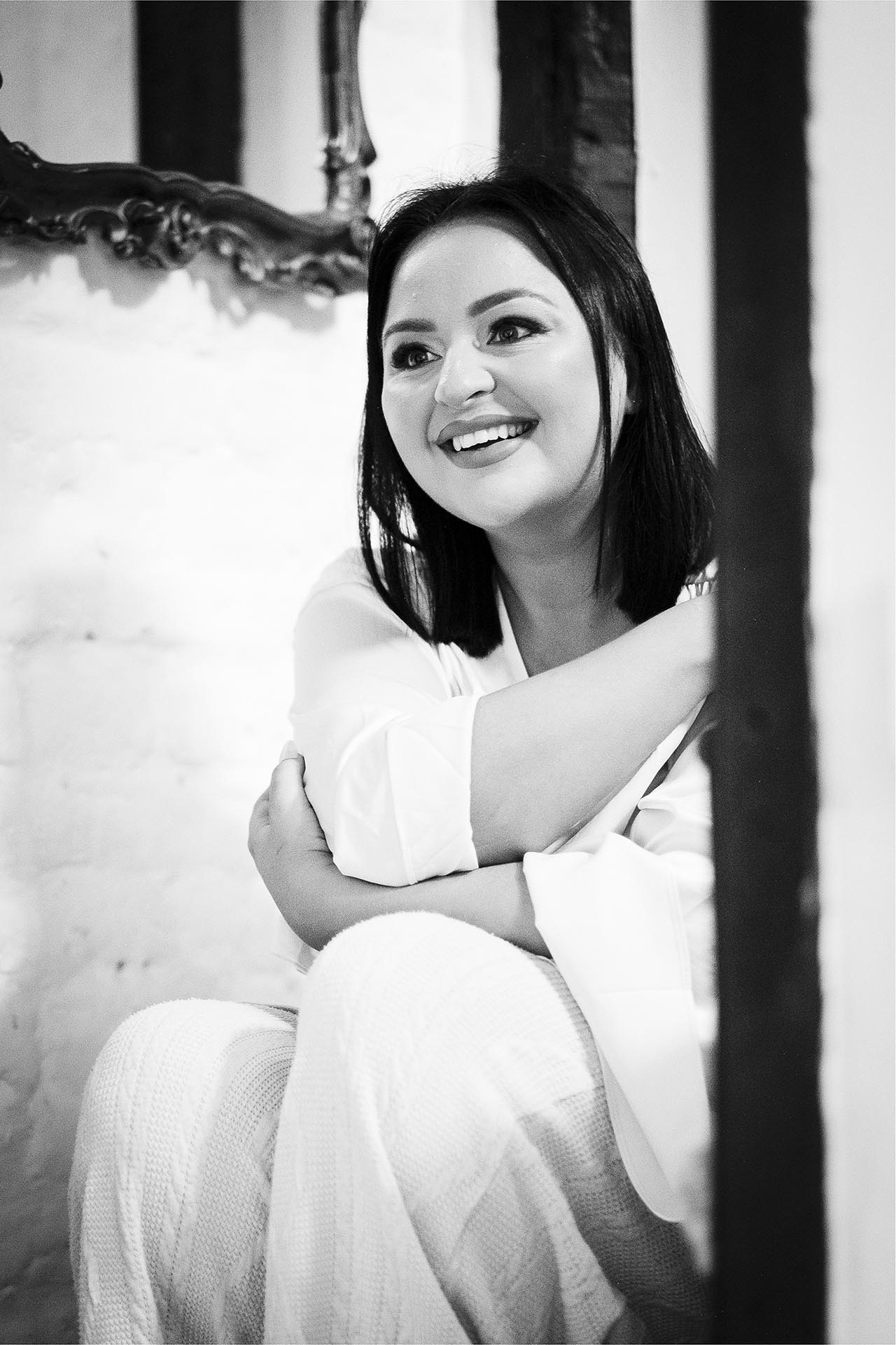 Black and white photograph of bride smiling