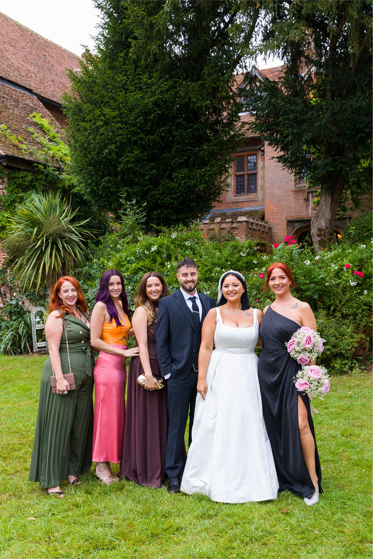 Wedding group photograph of bride and groom with their siblings