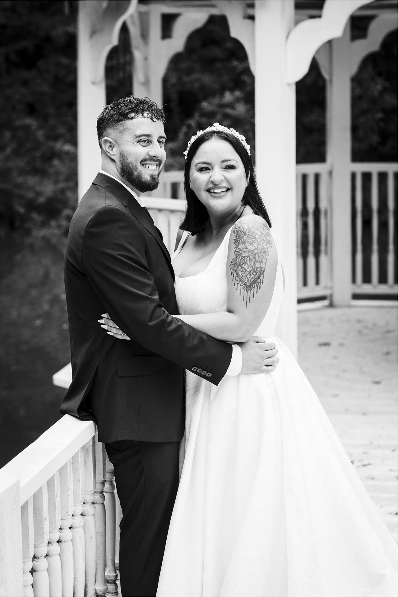 Black and white photograph of bride and groom in the Lake Pavillion at Creeksea Place Manor, Burnham-on-Crouch, Essex