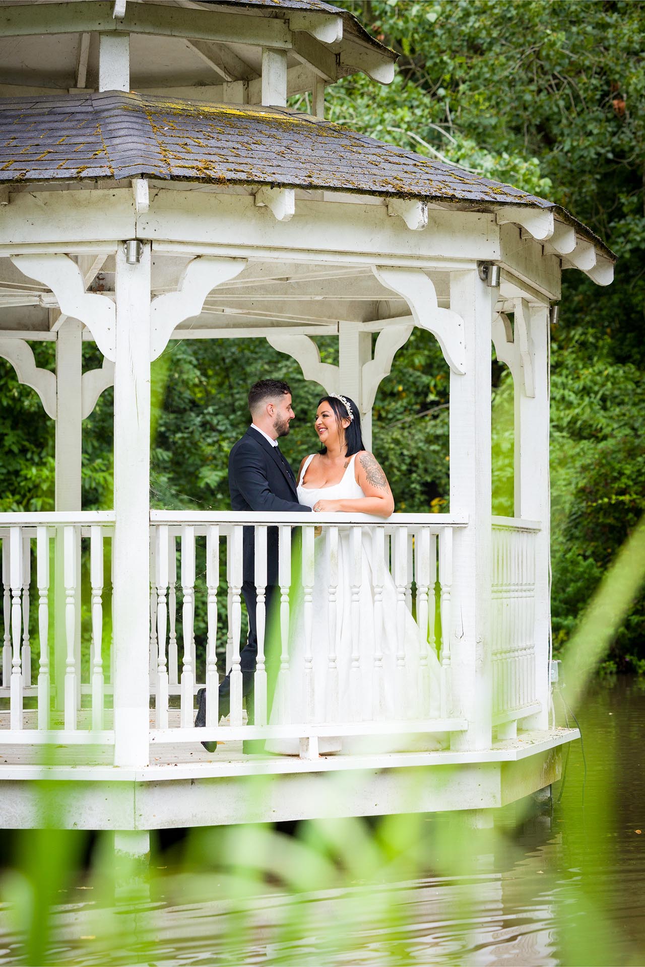 Photograph of bride and groom in the Lake Pavillion at Creeksea Place Manor, Burnham-on-Crouch, Essex