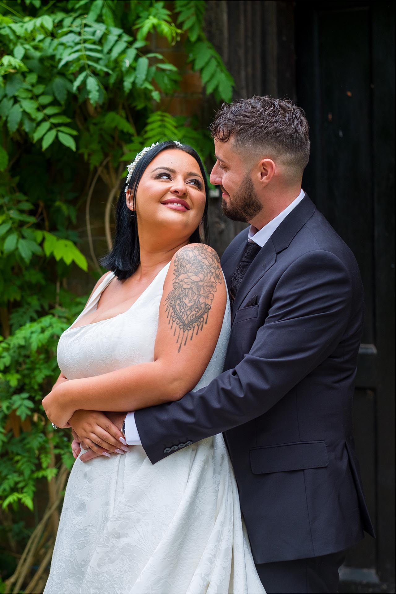 Photograph of bride and groom outside Creeksea Place Manor