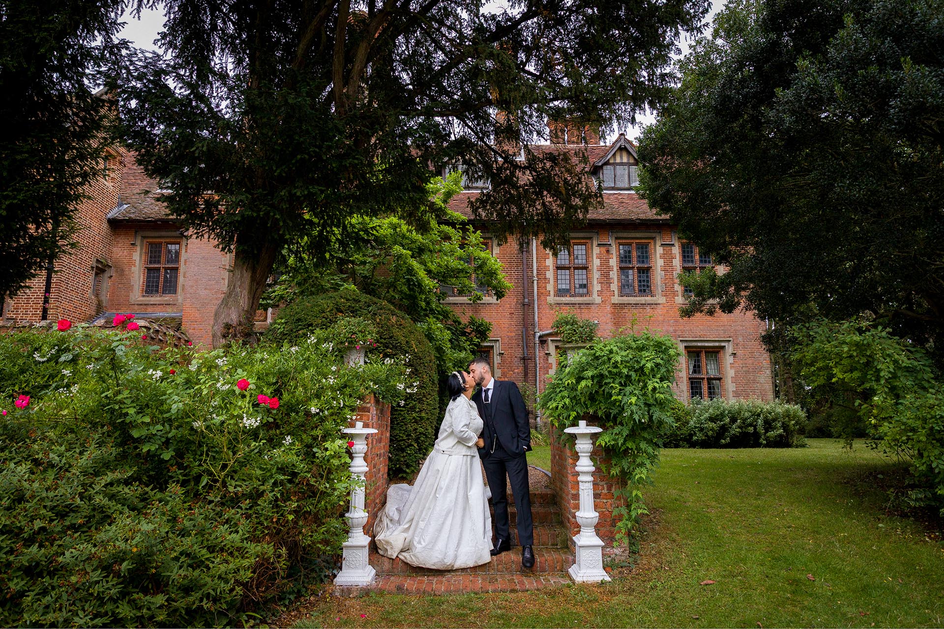 Photograph of bride and groom kissing at Creeksea Place, Burnham-on-Crouch, Essex
