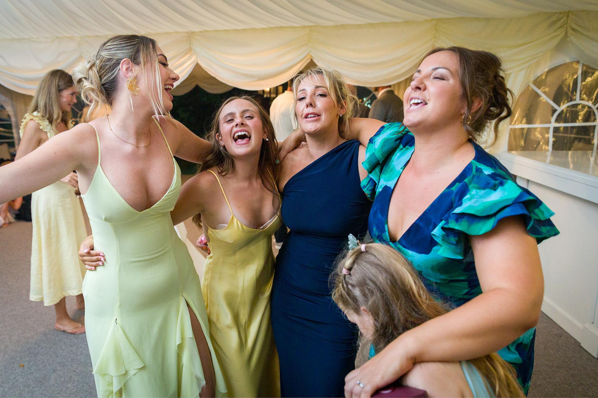 Photograph of wedding guests singing