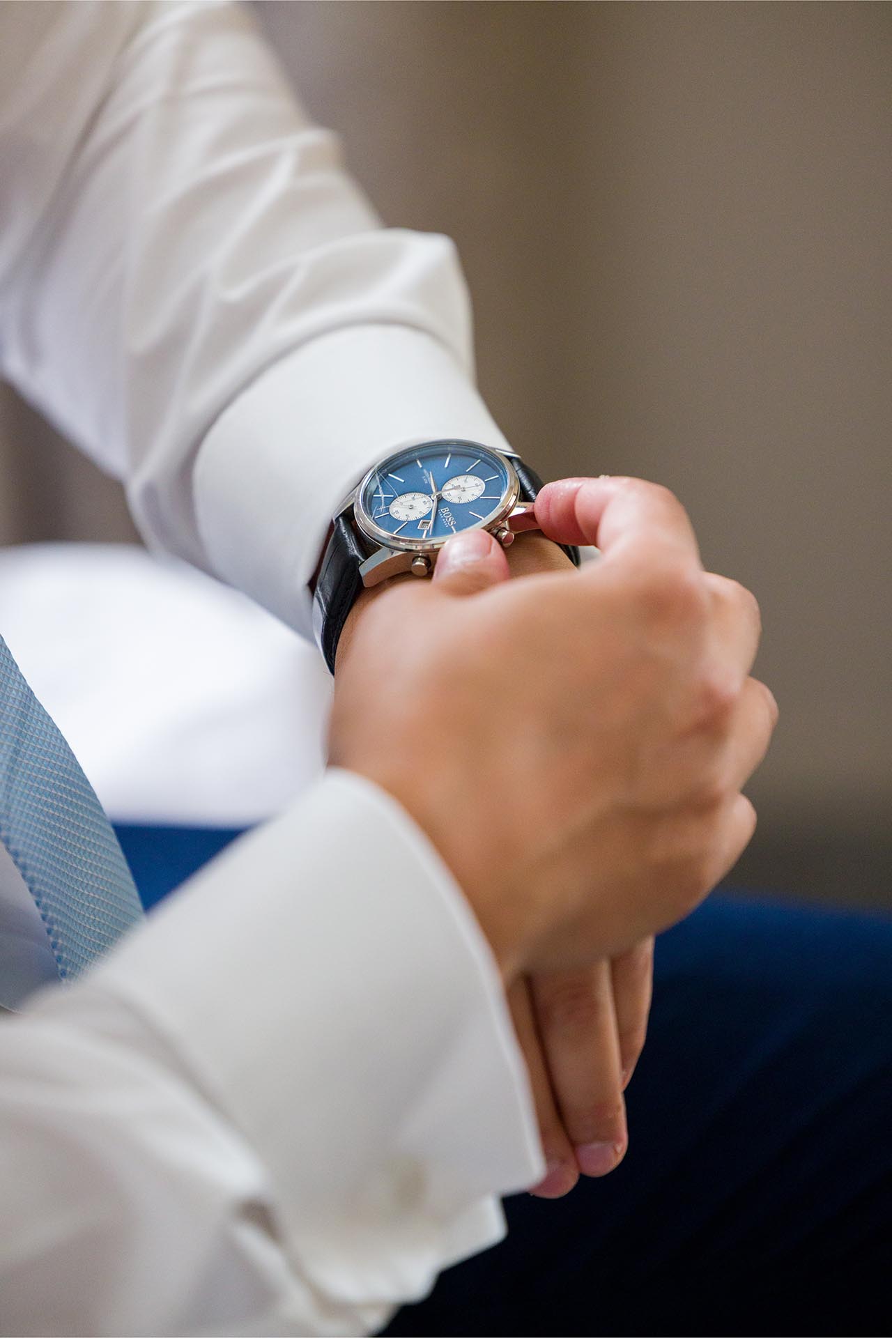 Close-up of a wristwatch being adjusted