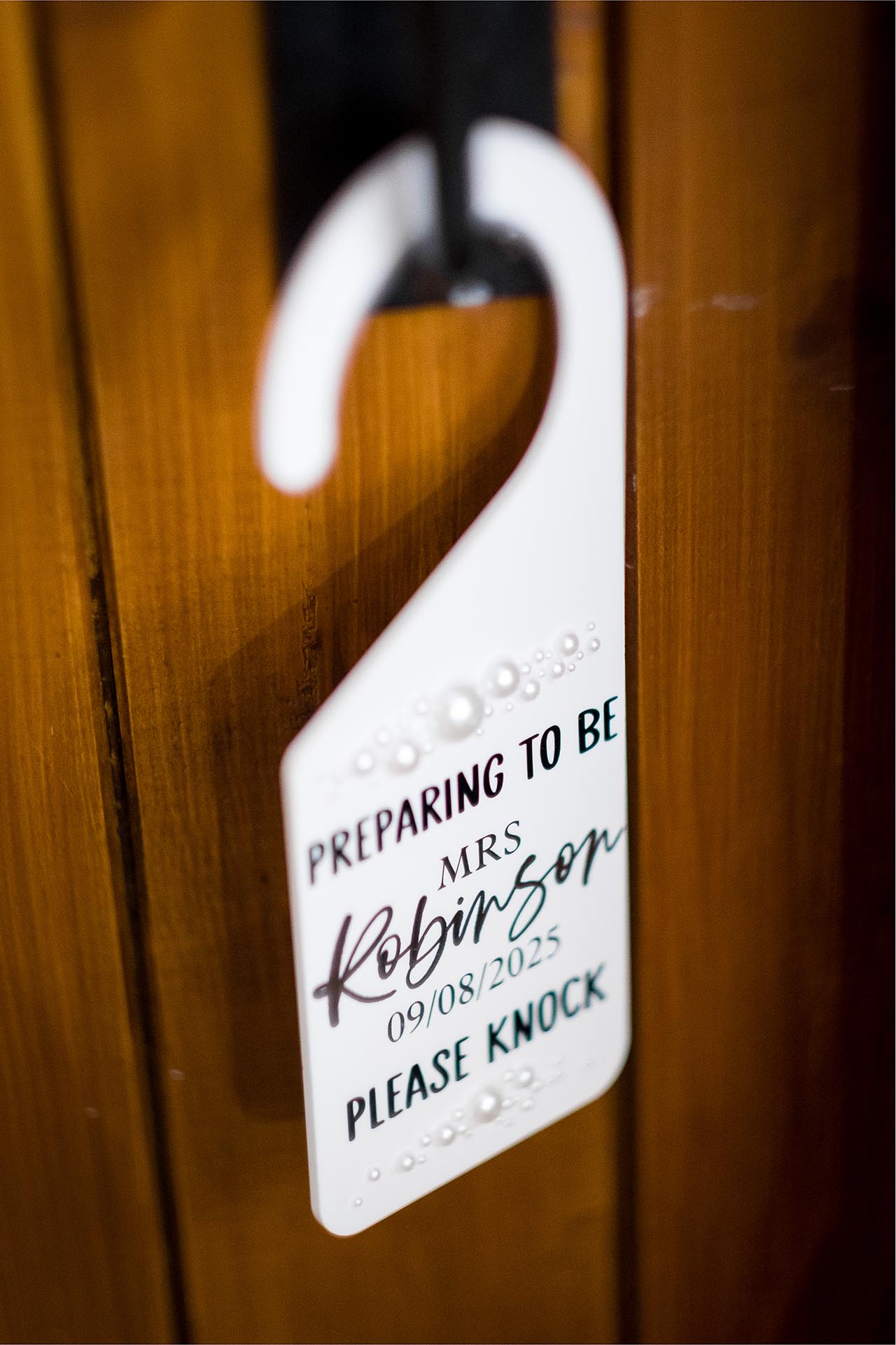 Close up photograph of a sign on a door handle