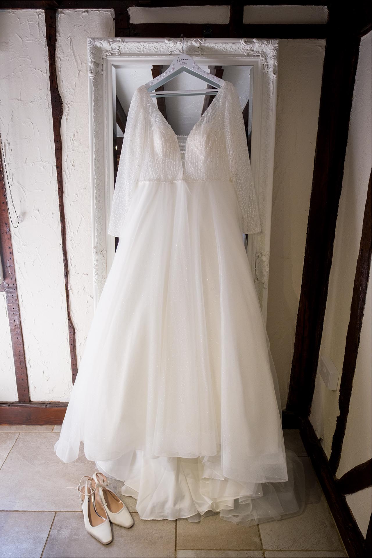 Photograph of a bridal gown and shoes
