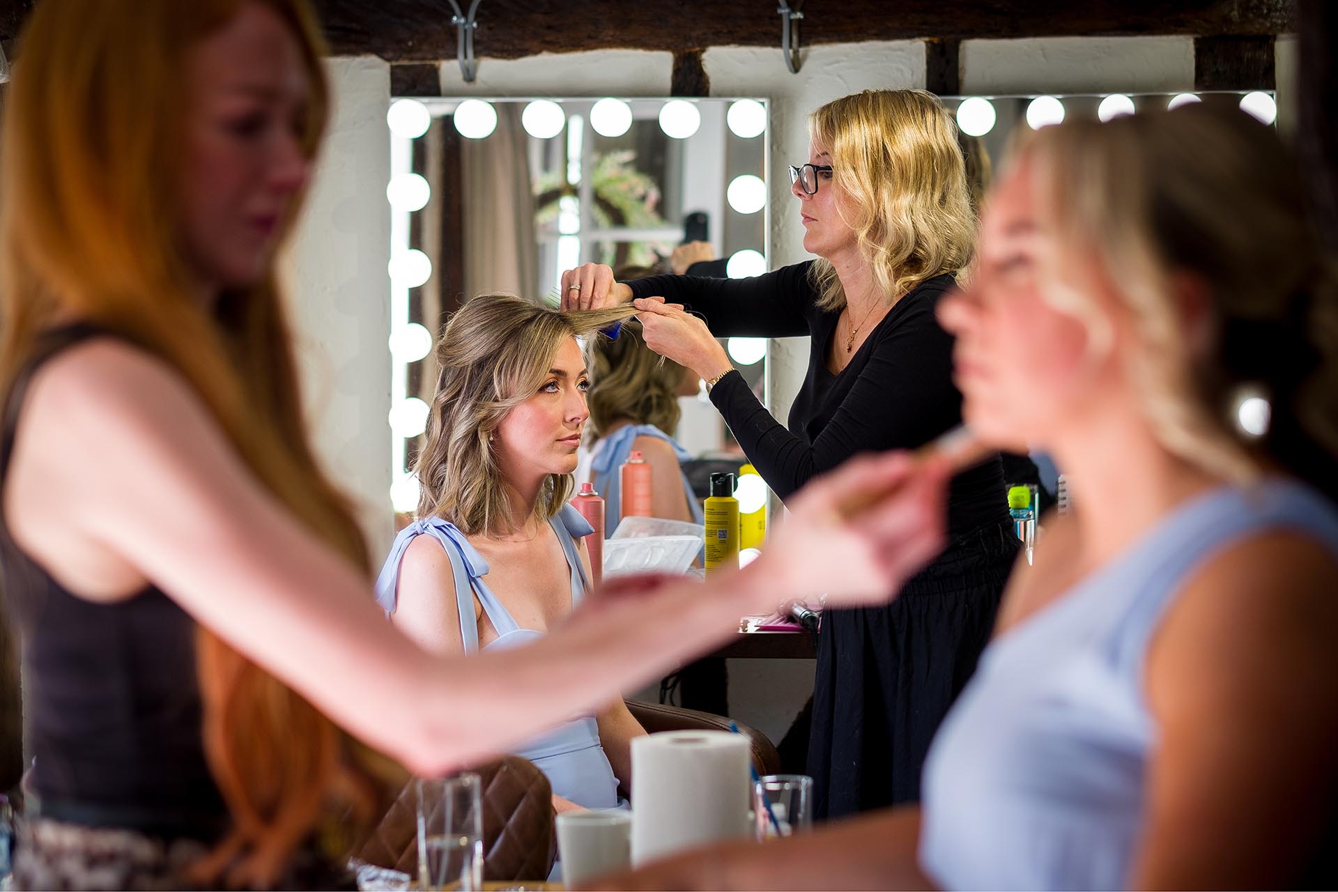 Bridesmaids having their hair and make-up being done