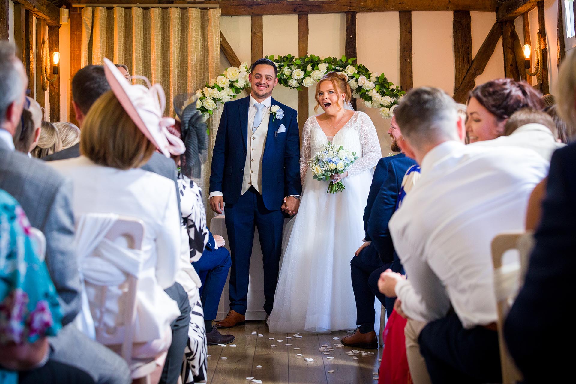 Bride and groom preparing to leave the ceremony room