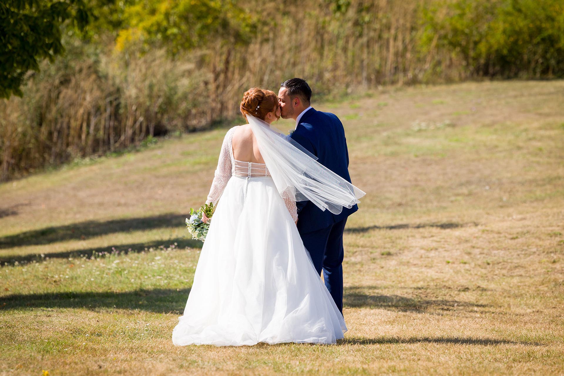 Bride and groom kissing at Little Channels, Essex