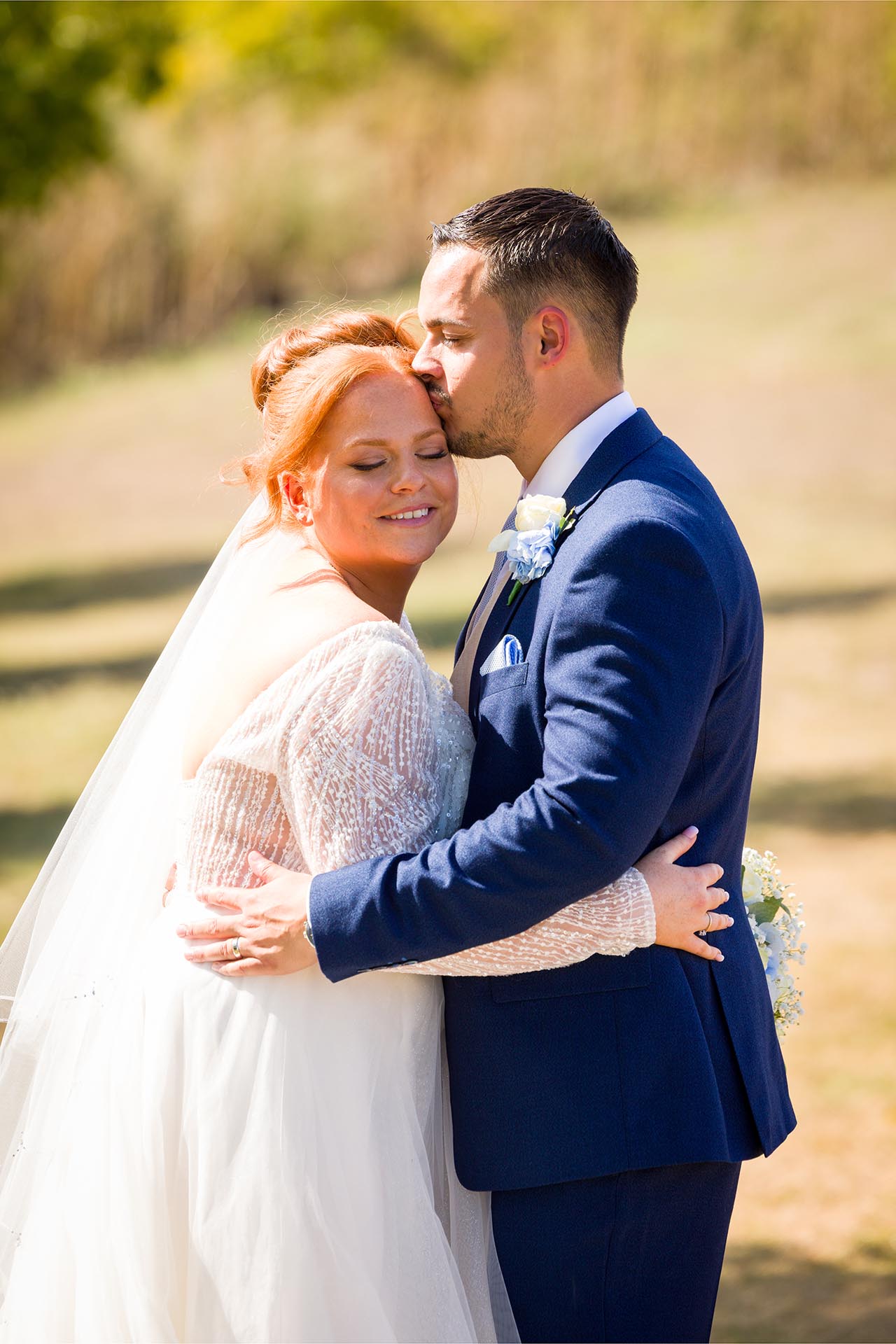 Groom kissing his bride