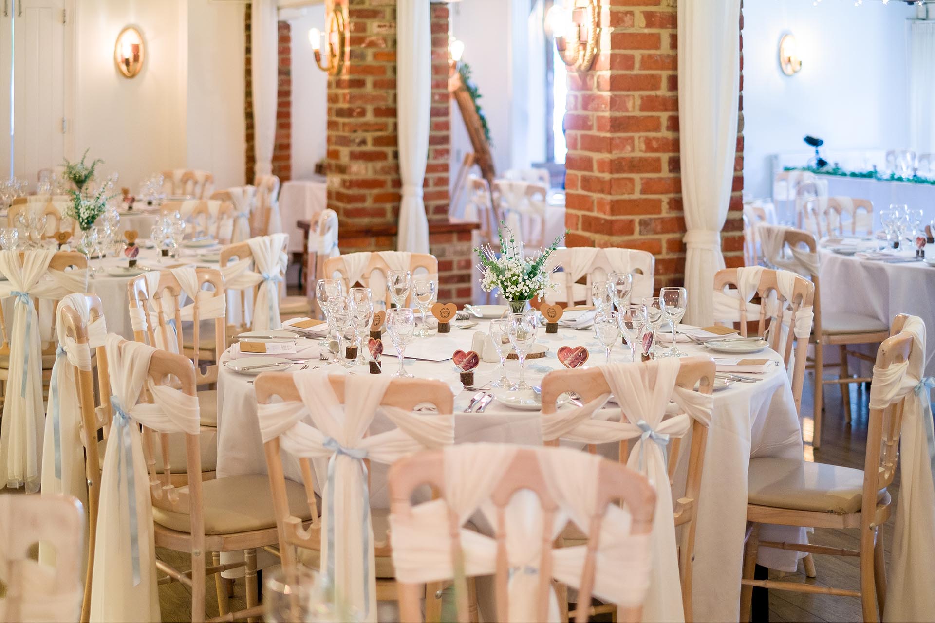 Tables and chairs set out for a wedding breakfast at Little Channels, Essex