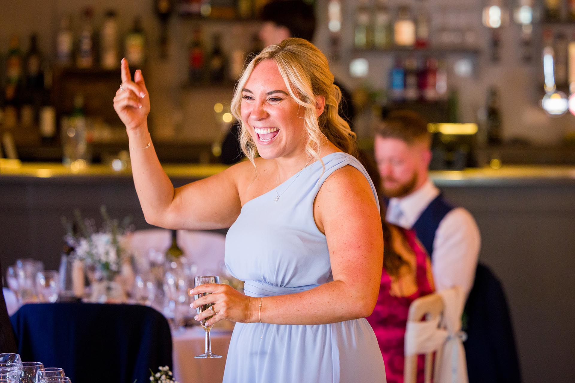 A laughing bridesmaid