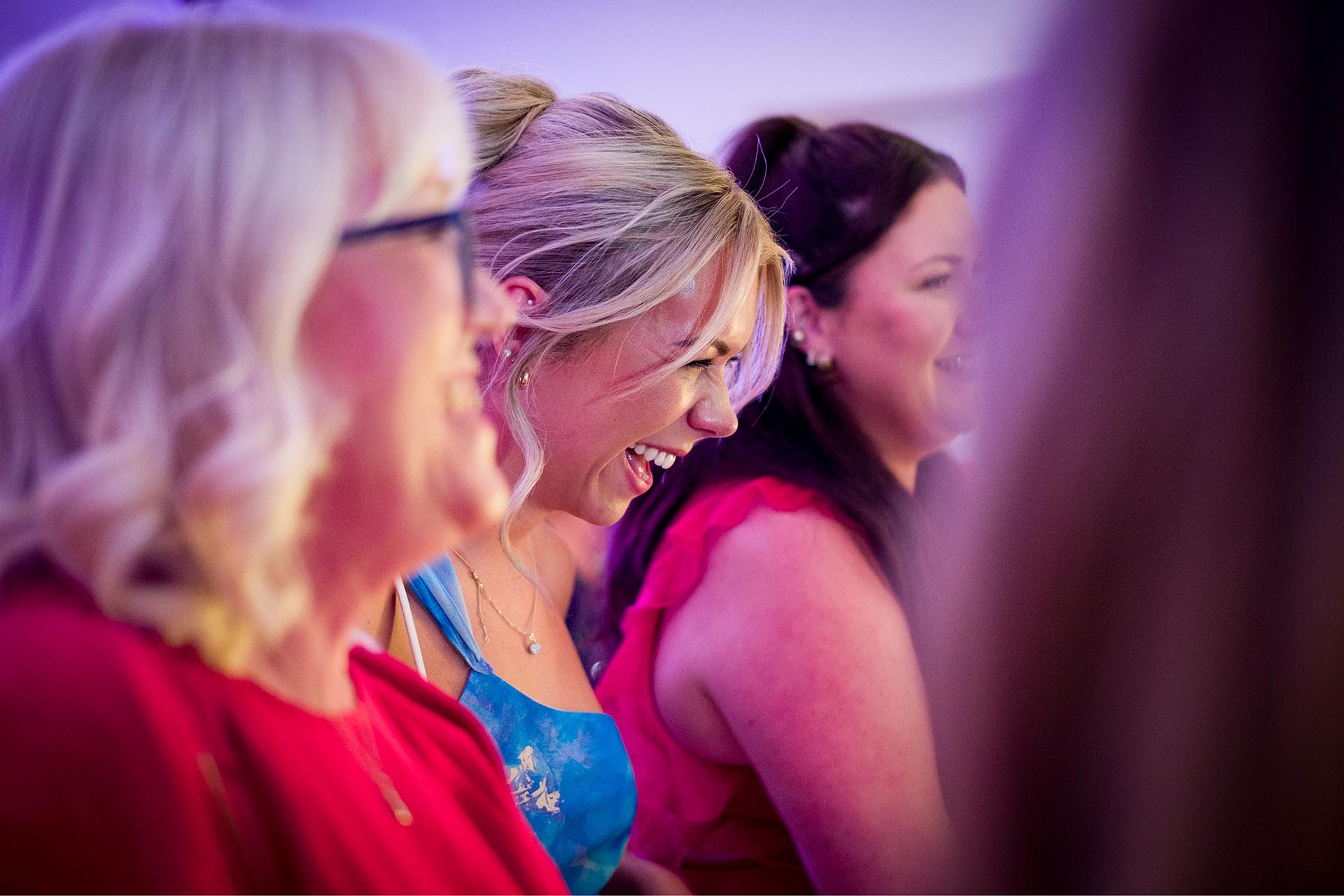 Wedding guests laughing